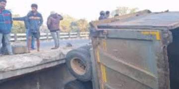 Truck Hangs from Bridge