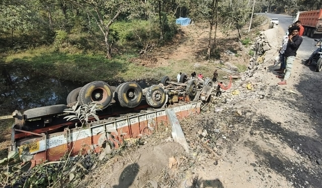 Truck Plunges 15 Feet