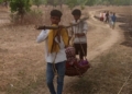 Pregnant woman carried for medical help