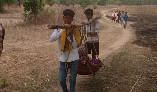 Pregnant woman carried for medical help